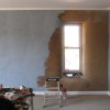 covering the base plaster with a color coat