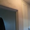 Clay plaster wraps around the bullnose of this door jamb.