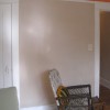 Subtle color of clay plaster framed by crisp trim.