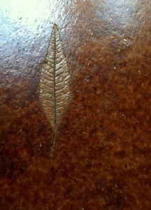 Leaf print in stained cornet floor